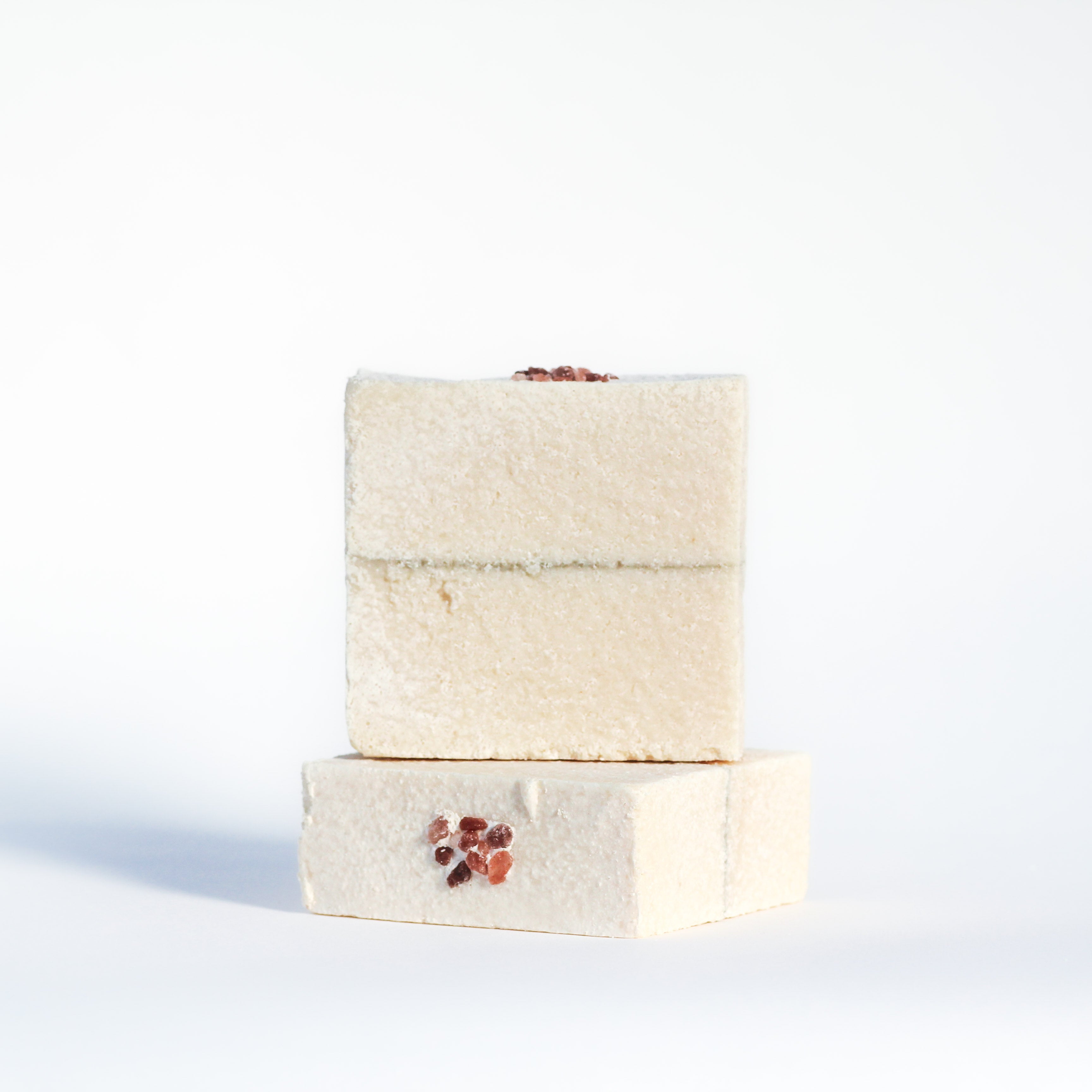 Salt soap stack with seaweed dividing line topped with chunky Himalayan salt.