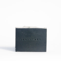 Activated Charcoal Soap with Santo Cabo stamp seal in the middle.