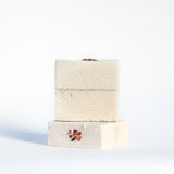 Salt soap stack with seaweed dividing line topped with chunky Himalayan salt. 